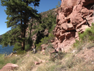 Red rocks, green pines, blue sky and river
